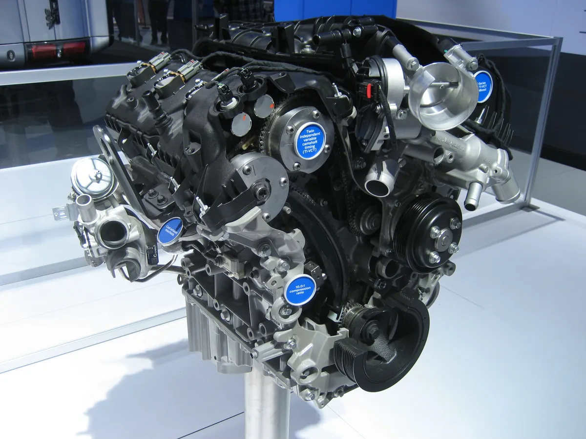 A Ford 3.5 EcoBoost V6 engine on a display stand