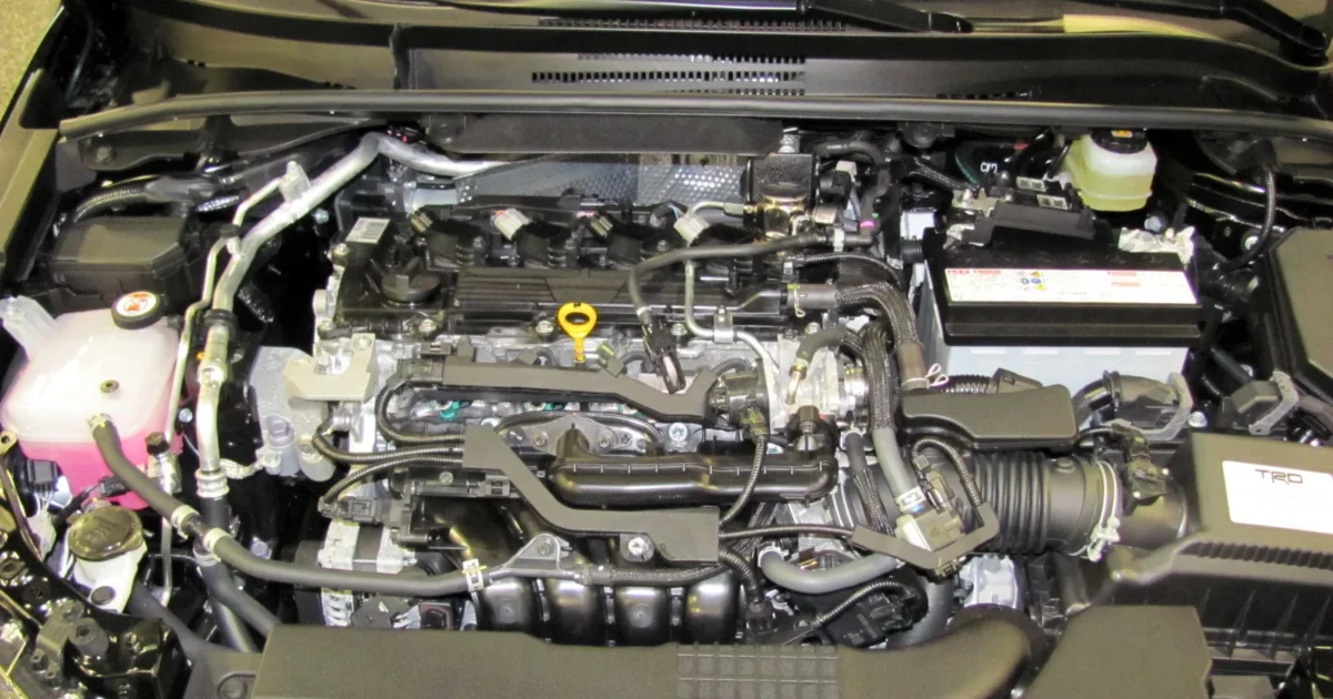 The open engine bay of a 2019 Toyota Corolla hatchback with its 2.0 liter four cylinder engine
