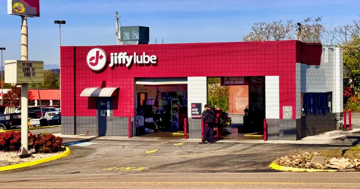 Real Jiffy Lube oil change shop with red fascia and open service bays in Knoxville, Tennessee.
