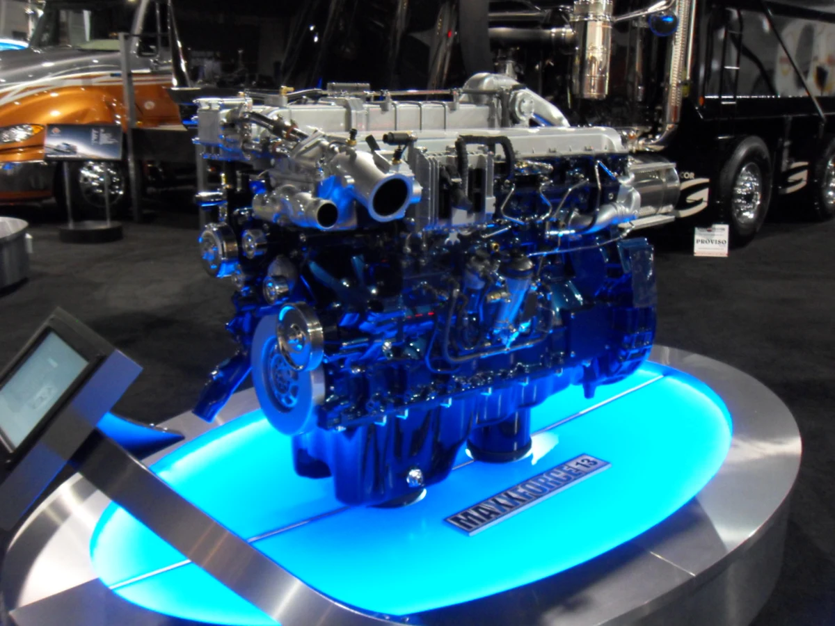 An International MaxxForce diesel engine exhibited outside a truck, showing its pipes and external equipment.