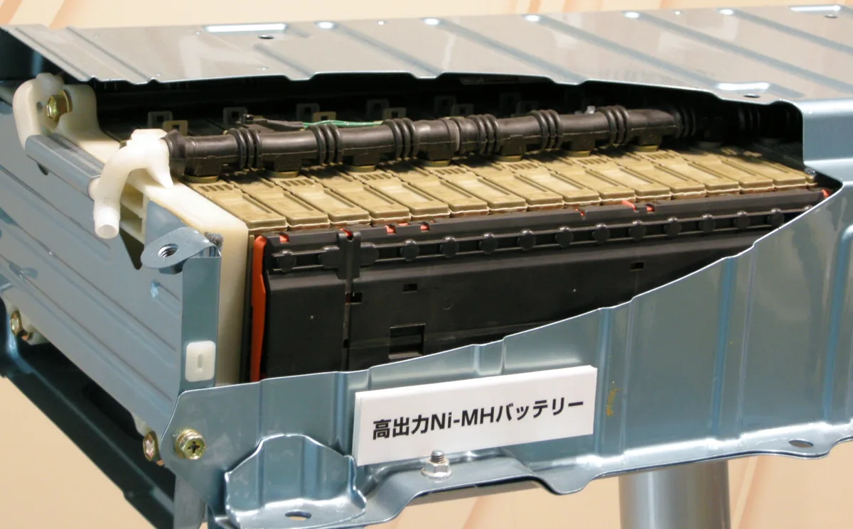 A cutaway Prius hybrid battery pack on display, showing the rows of cells inside
