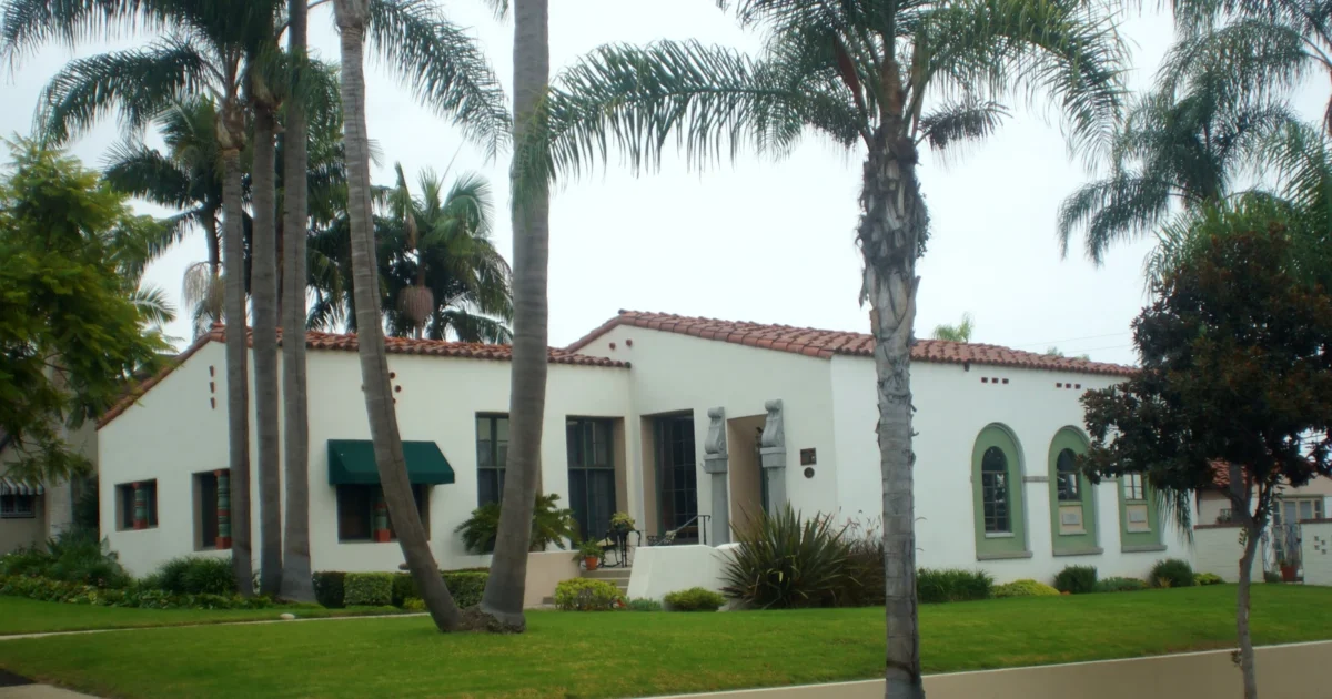 Light-colored stucco exterior of the Hugh Edgar Johnson House in Fullerton, California.